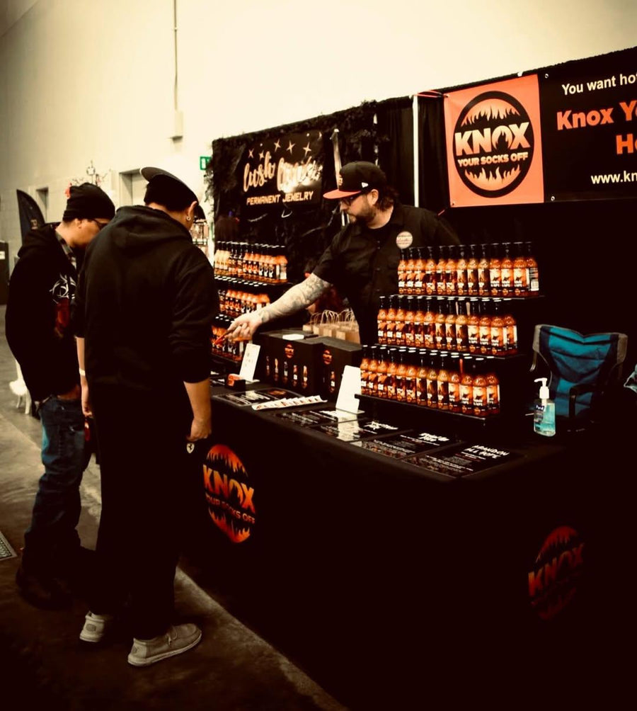 Knox Your Socks Off booth with shelves of hot sauce